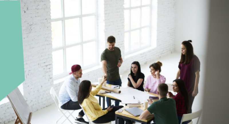 Group of people around a table discussing work