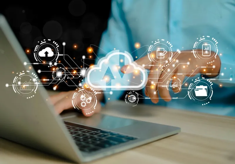 Businessmen use computers to visualize large online data in the cloud. 