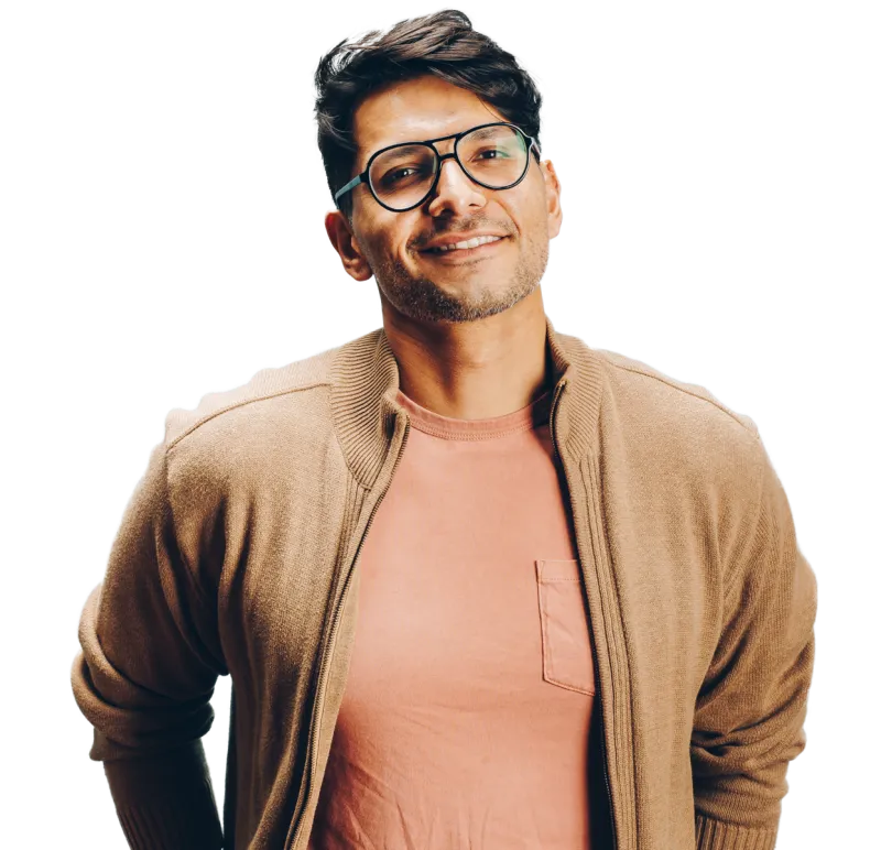 A man with glasses smiling.