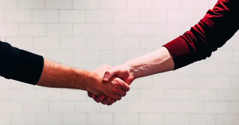 two people shaking hands