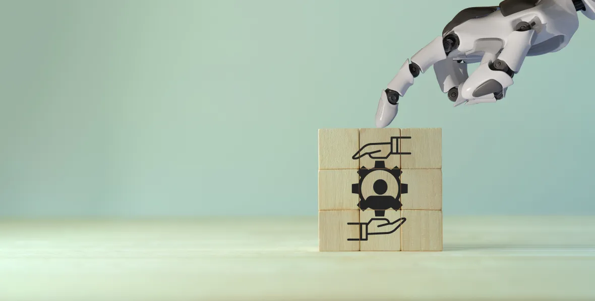 Robotic hand placing a block with a gear icon, symbolizing responsible AI in benefits administration.